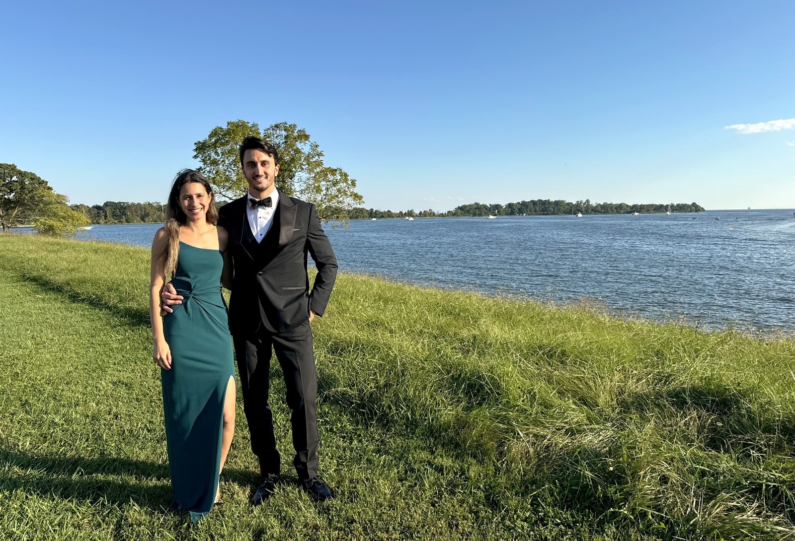 Amanda and Alexander in formal attire by the water